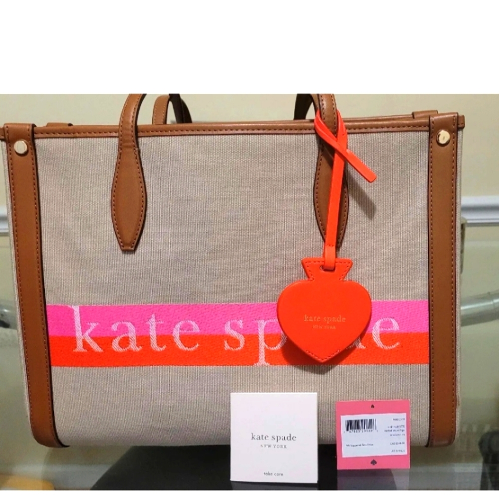 Kate Spade medium canvas bag.  It's 12.5" wide and 9.5" in height.